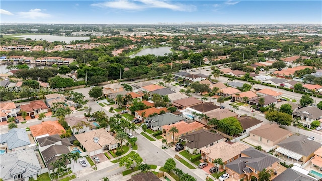 birds eye view of property featuring a water view and a residential view