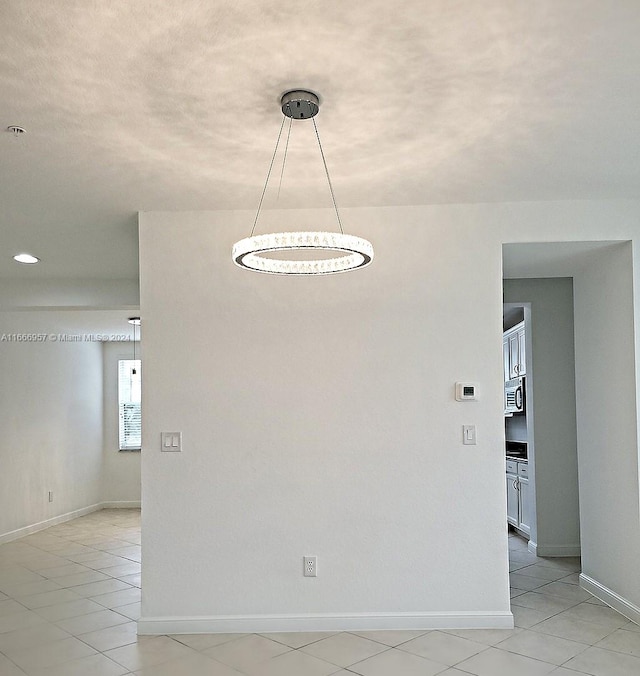 unfurnished room with light tile patterned floors