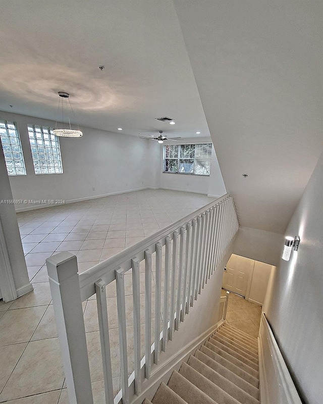 stairs featuring tile patterned flooring