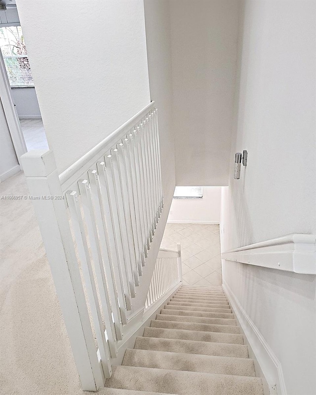 stairway with carpet floors