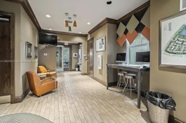 interior space featuring crown molding and light hardwood / wood-style floors