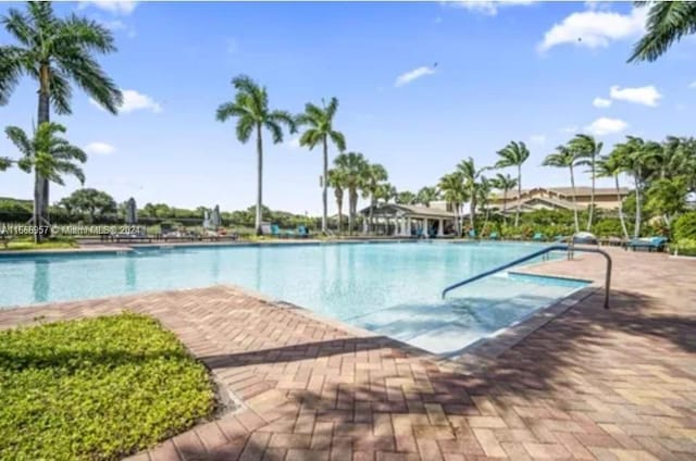 view of swimming pool with a patio area