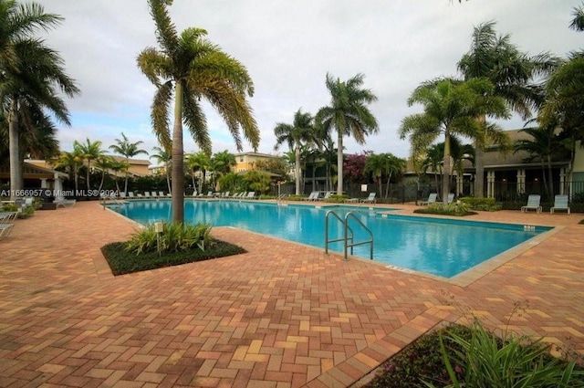 view of swimming pool with a patio area