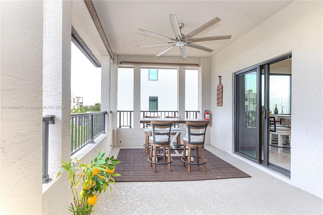 sunroom / solarium featuring a wealth of natural light and ceiling fan