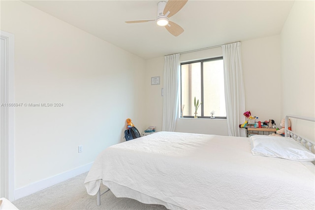 bedroom with ceiling fan and carpet floors