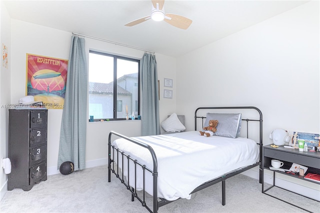 bedroom featuring light carpet and ceiling fan