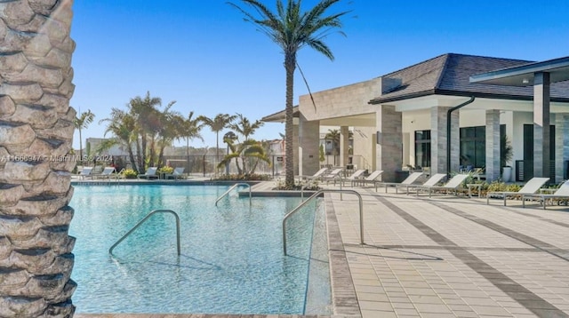 view of swimming pool with a patio area