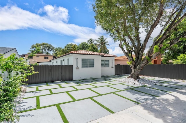 back of property featuring a patio