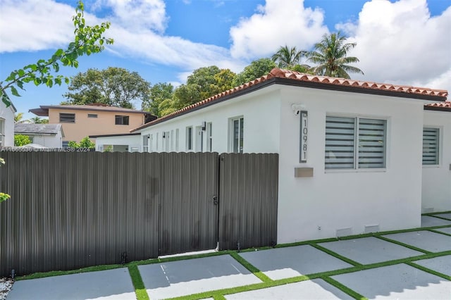 view of property exterior featuring a patio area