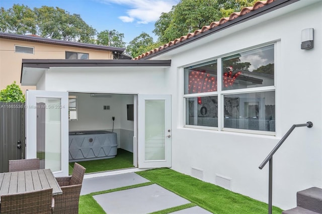 exterior space with a jacuzzi