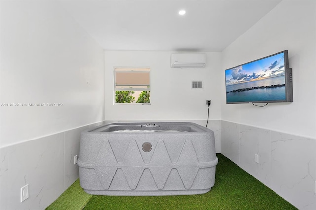 bedroom featuring an AC wall unit