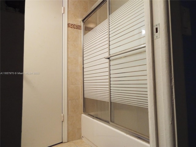 bathroom with tile patterned floors and enclosed tub / shower combo