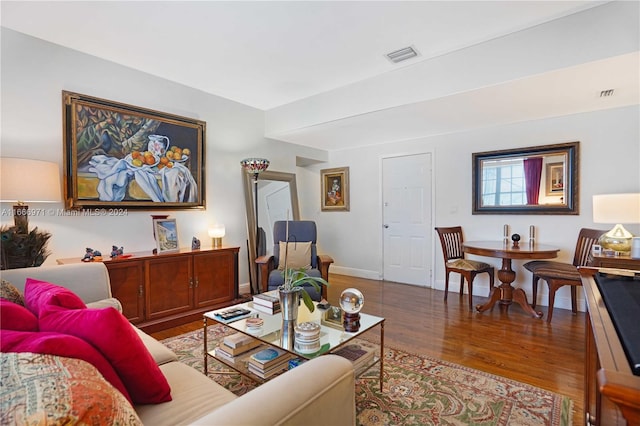 living room with dark hardwood / wood-style floors