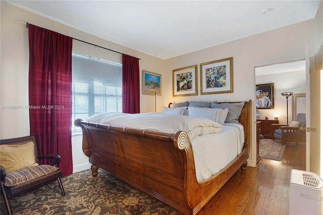 bedroom featuring hardwood / wood-style floors