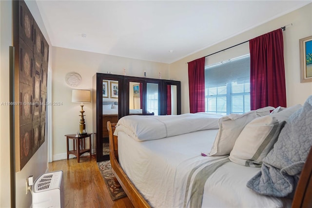 bedroom with light hardwood / wood-style flooring