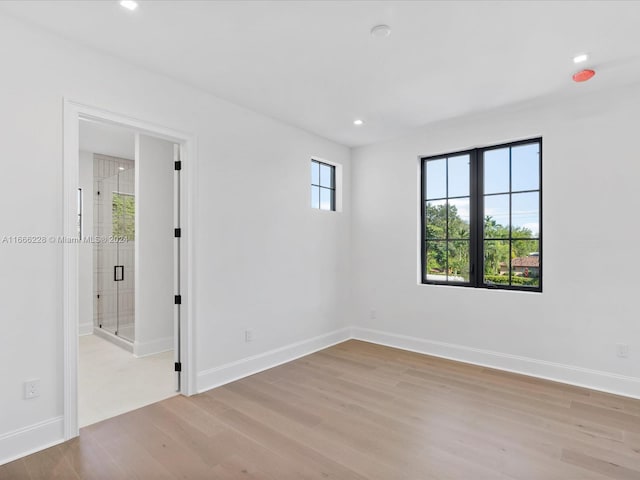 unfurnished room featuring light hardwood / wood-style flooring