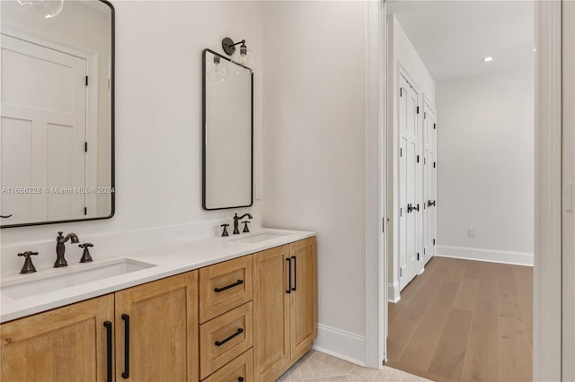 bathroom featuring wood-type flooring and vanity