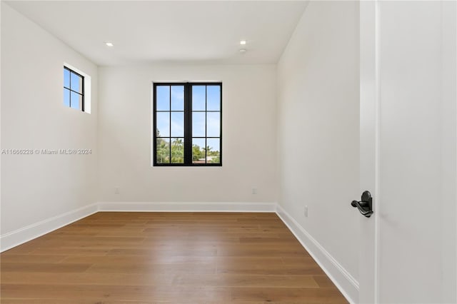 spare room with hardwood / wood-style floors