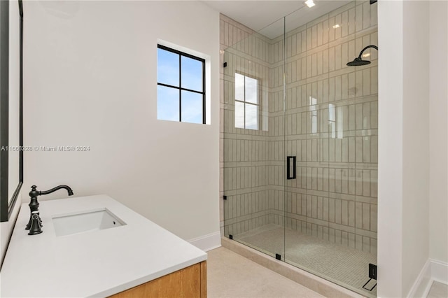 bathroom featuring vanity and a shower with shower door