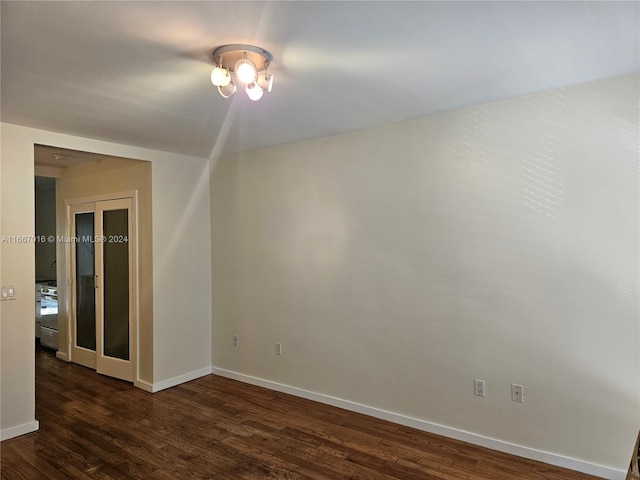 unfurnished room featuring dark hardwood / wood-style floors