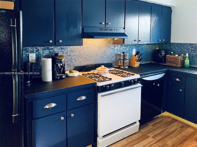 kitchen with blue cabinets, light hardwood / wood-style floors, tasteful backsplash, and black appliances