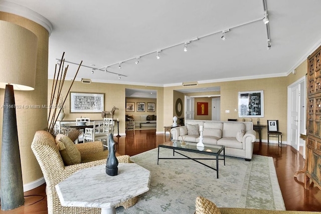 living room featuring ornamental molding, hardwood / wood-style flooring, and rail lighting