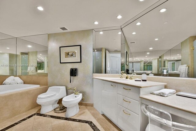 bathroom featuring a bidet, visible vents, toilet, and vanity