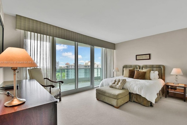 bedroom featuring carpet and access to outside