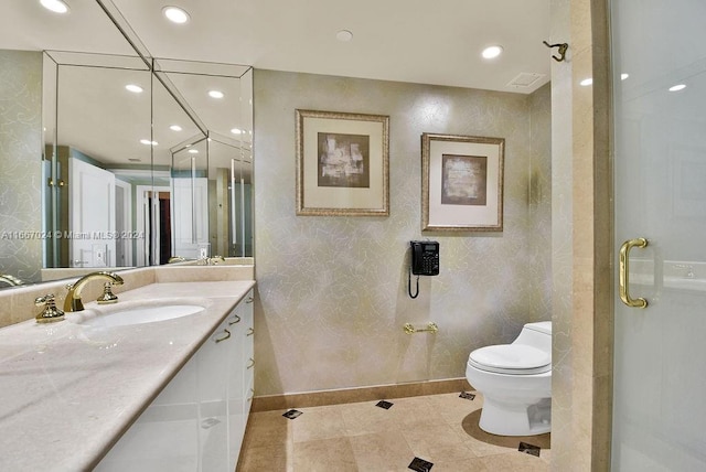 bathroom with tile patterned floors, vanity, and toilet