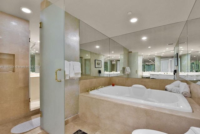 bathroom with vanity, plus walk in shower, and tile patterned flooring