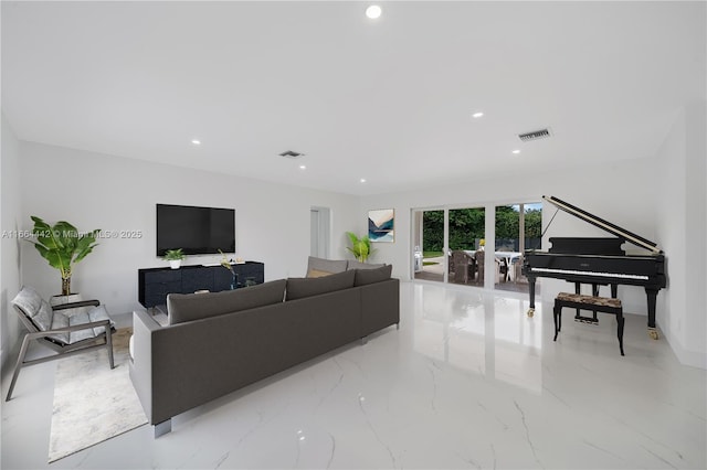 living room featuring recessed lighting, marble finish floor, and visible vents