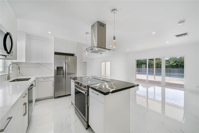 kitchen with stainless steel appliances, a sink, white cabinets, marble finish floor, and island exhaust hood