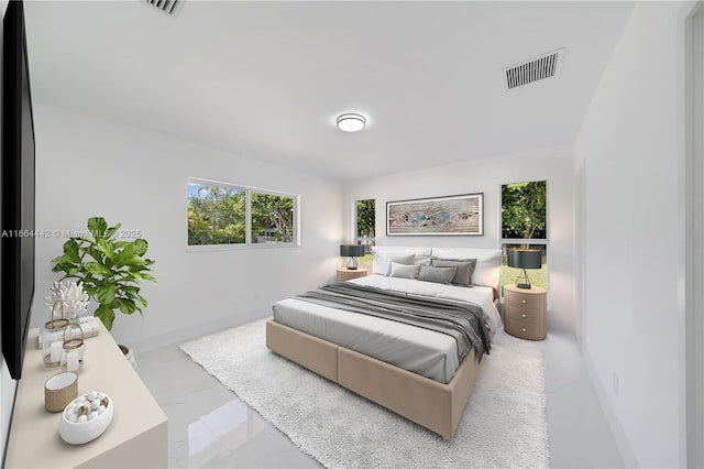 bedroom featuring visible vents and baseboards