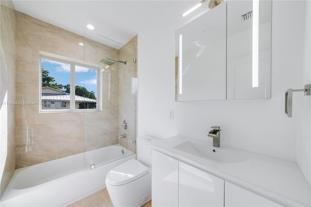 bathroom featuring tub / shower combination, vanity, and toilet