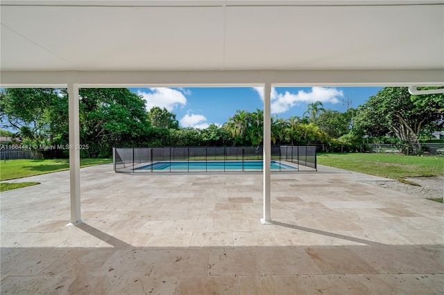 view of pool with a yard, fence, a fenced in pool, and a patio