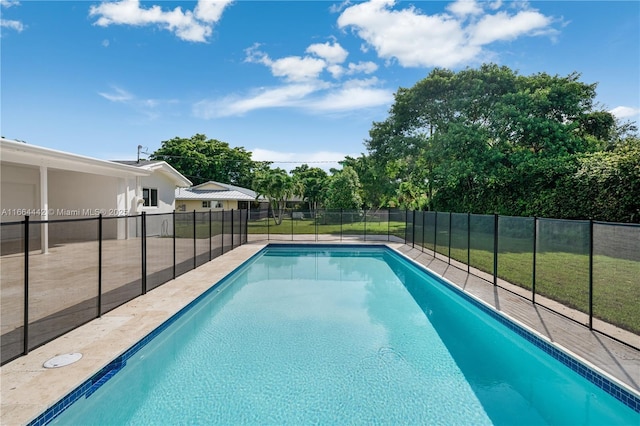 view of swimming pool with a fenced in pool, a patio area, fence, and a lawn