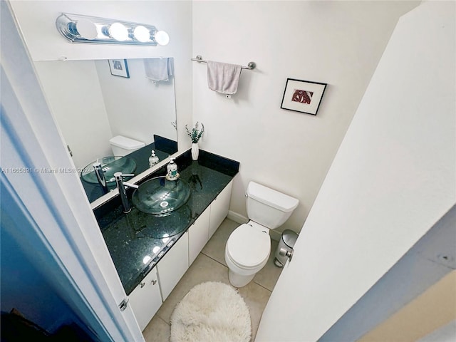 bathroom featuring vanity, toilet, and tile patterned floors