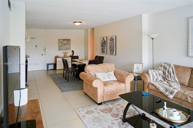 tiled living room with a textured ceiling