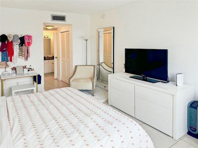 bedroom with light tile patterned flooring