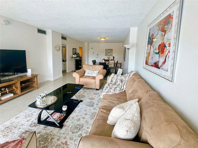 500 Bayview Dr Unit 325, Sunny Isles Beach, FL 33160 - living room with a textured ceiling and tile patterned flooring