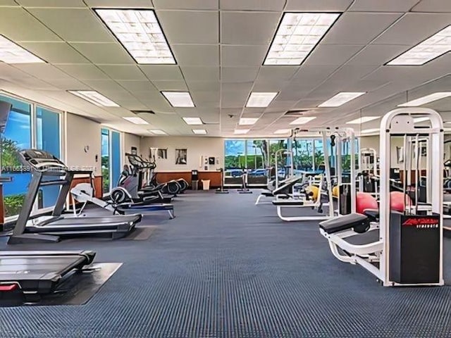 exercise room with a paneled ceiling