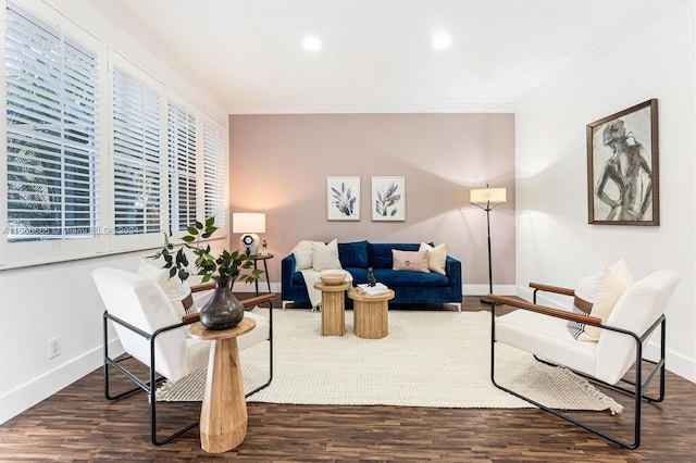 living room featuring crown molding and dark wood-type flooring