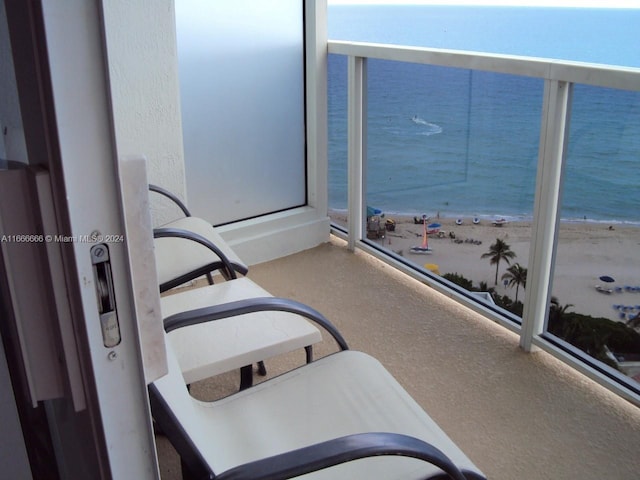 balcony with a view of the beach and a water view