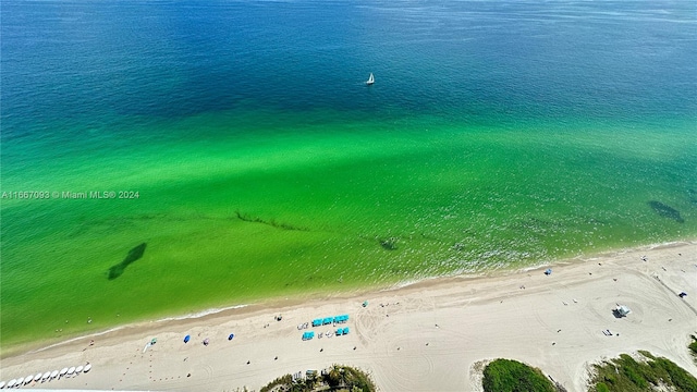 bird's eye view with a beach view and a water view