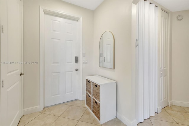 hallway with light tile patterned floors