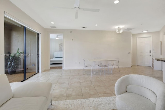 living room with ceiling fan and light tile patterned floors