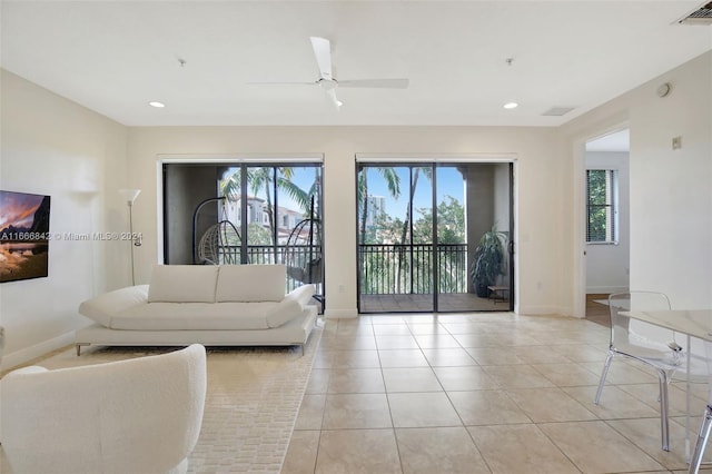 tiled living room with ceiling fan