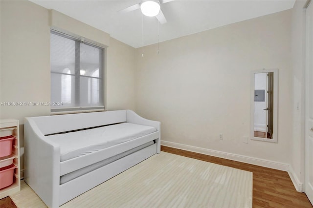 bedroom with hardwood / wood-style floors and ceiling fan