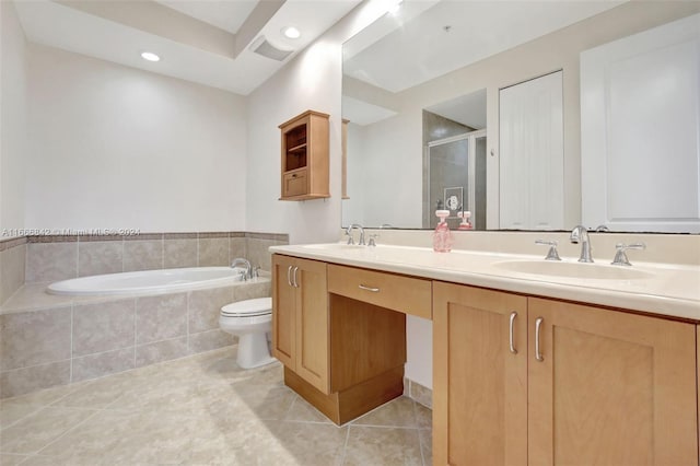 full bathroom with plus walk in shower, tile patterned floors, vanity, and toilet