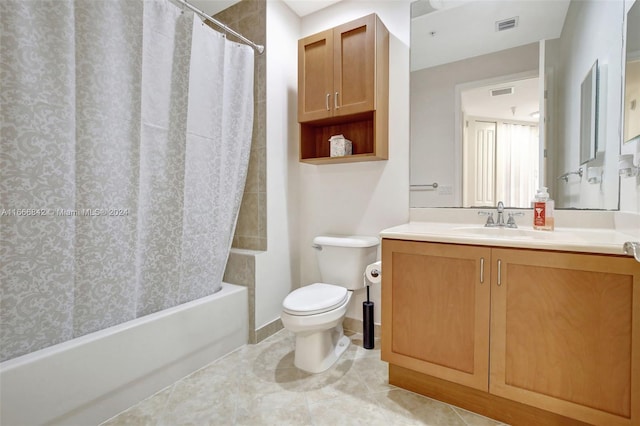 full bathroom featuring shower / tub combo, vanity, toilet, and tile patterned floors